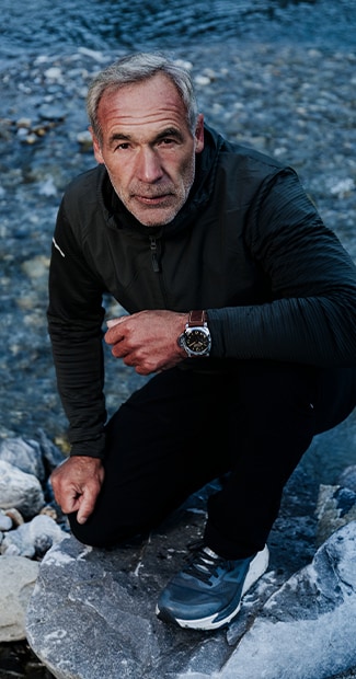 Mike Horn outdoors in sporty outfit with Panerai watch